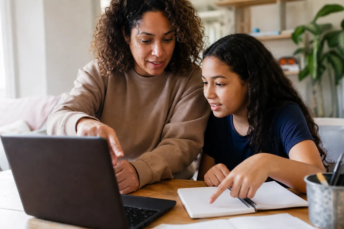 A parent and child reviewing an AI output together after a first session